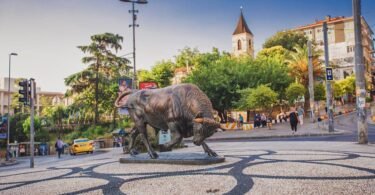 The famous bronze Bull statue (Boğa Heykeli) at the Altıyol intersection, a key meeting point in the heart of the Kadıköy district on the Asian side of Istanbul.